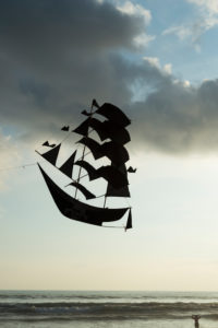 Kite flying, flying sailing ship on the beach near Seminyak Kite flying, flying sailing ship on the beach near Seminyak